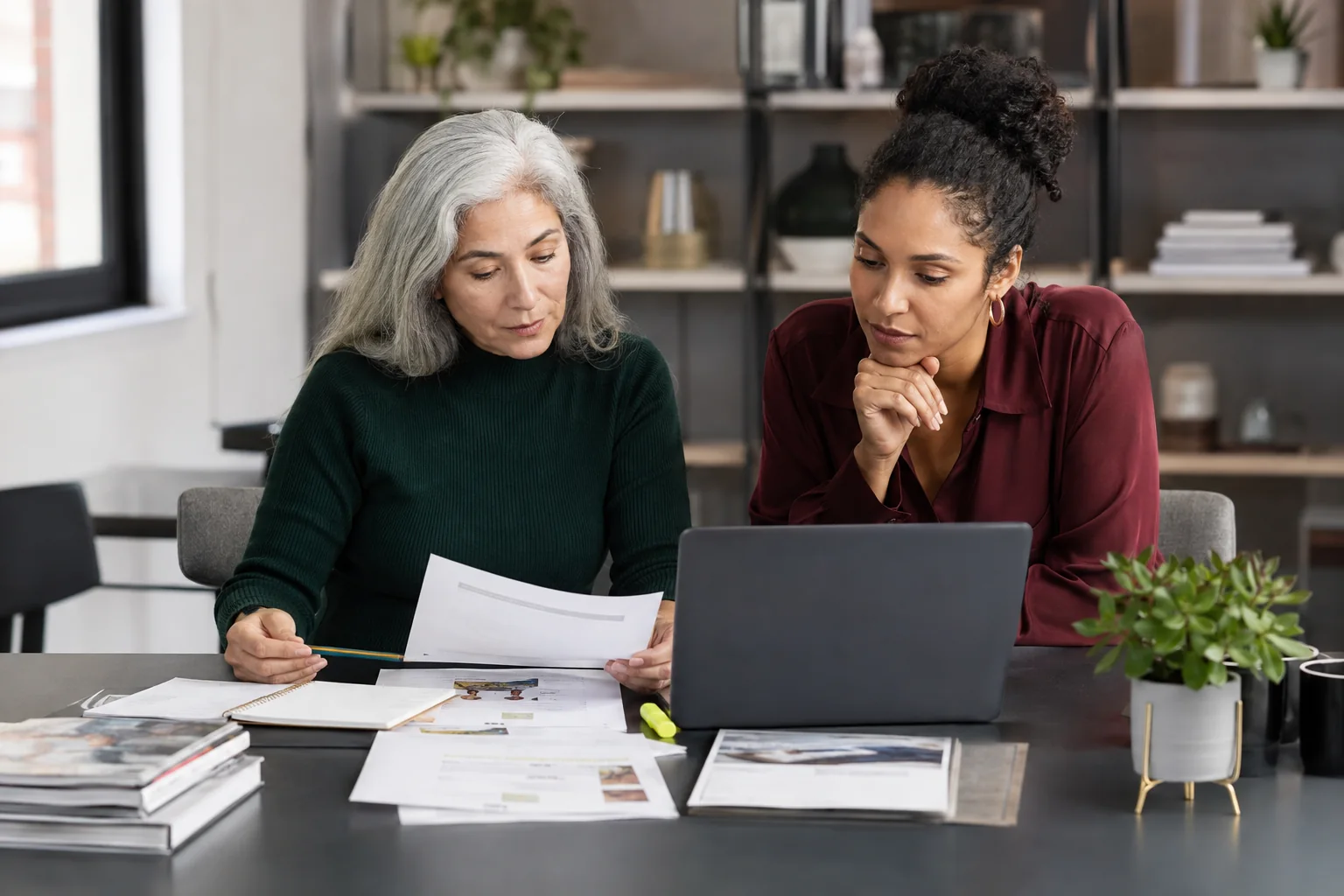 Women editors reviewing article evidence, audience relevance, and disclosure notes